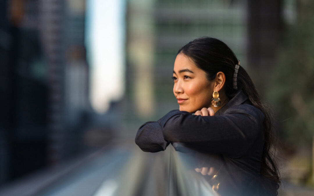woman deep in thought, women in city,